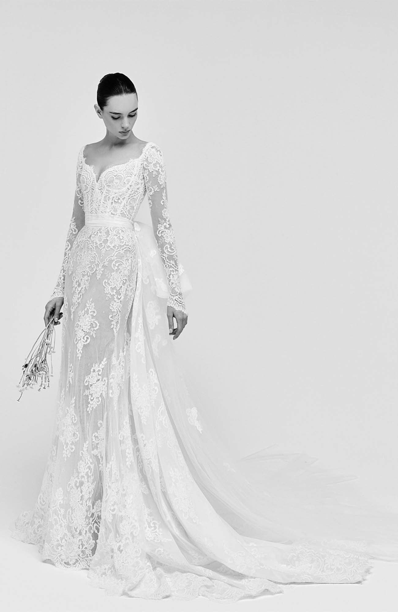 Zuhair Murad Mariage Spring 2026 Look 3 back view of strapless lace wedding dress with oversized satin bow and full overskirt