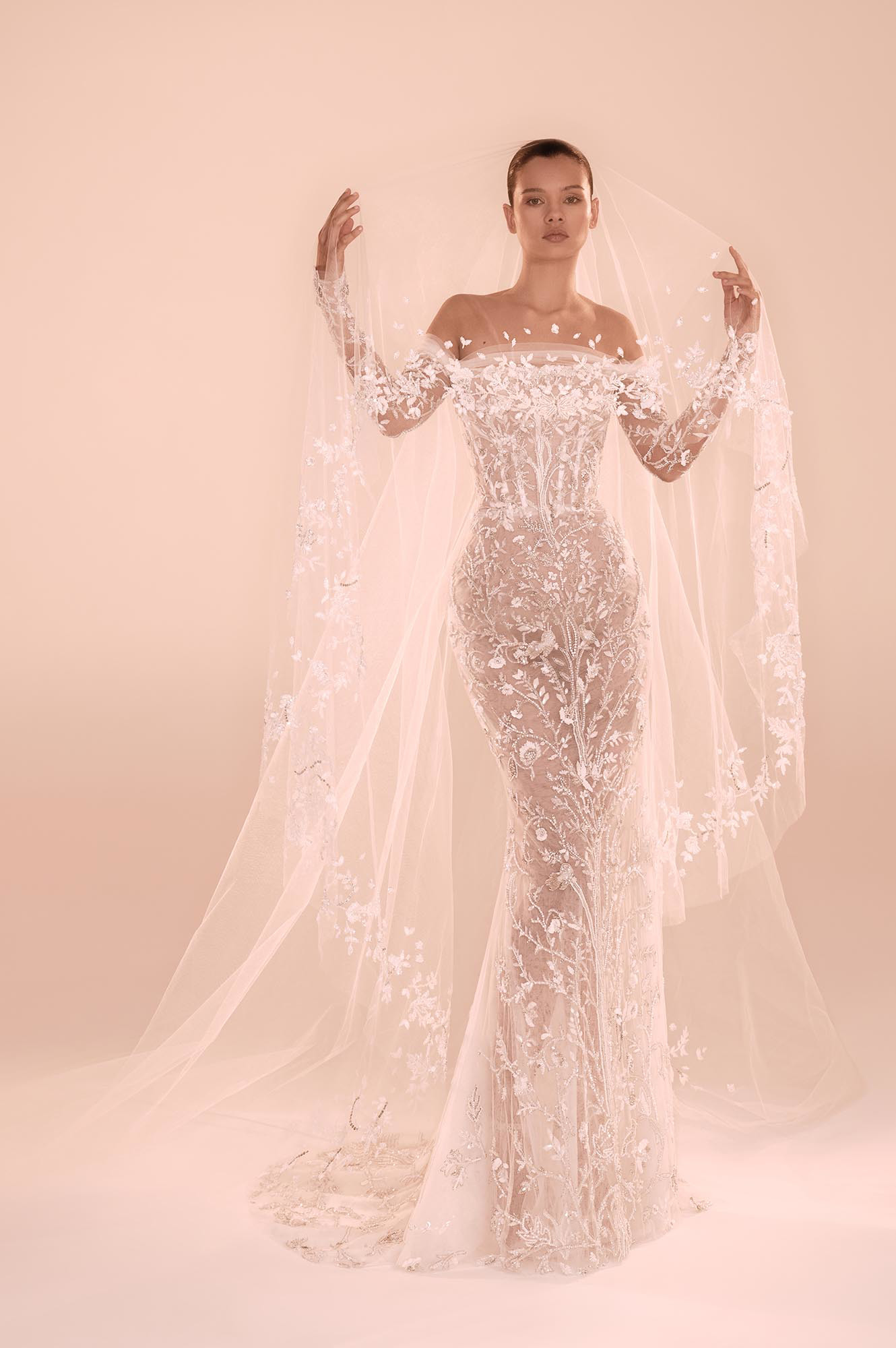 Zuhair Murad Mariage Fall 2026 Look 7 side view of off-shoulder lace wedding dress with detachable overskirt and long train